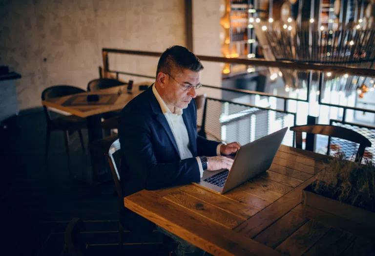 Business man looking on laptop
